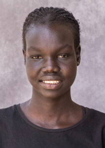 Photo of Adhieu Jok in black blouse.